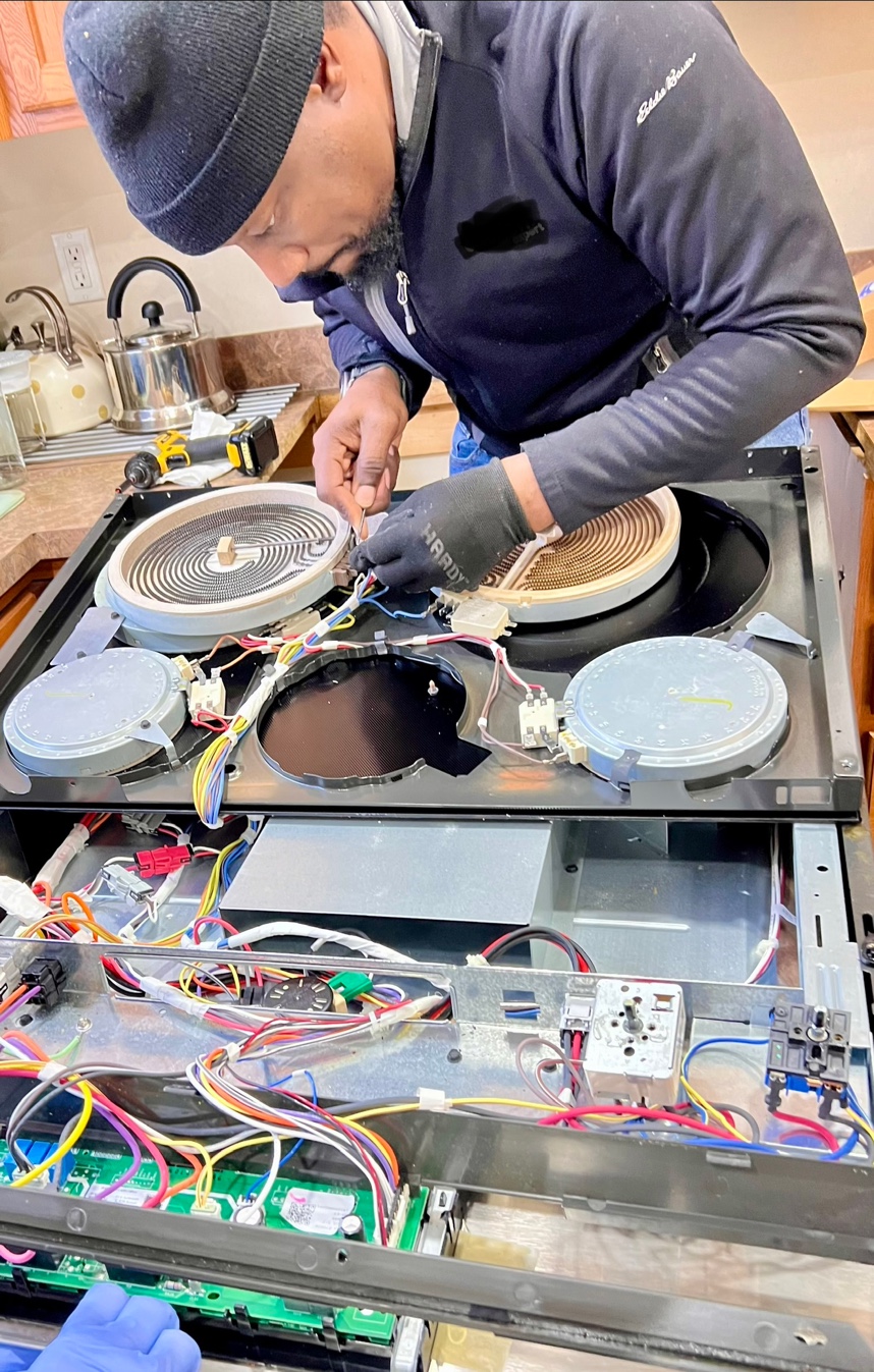 Close-up appliance repair work